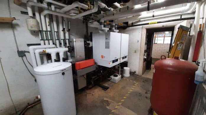 A cascading condensing-boiler system installed in a mechanical room, photographed on one of Dave's jobs
